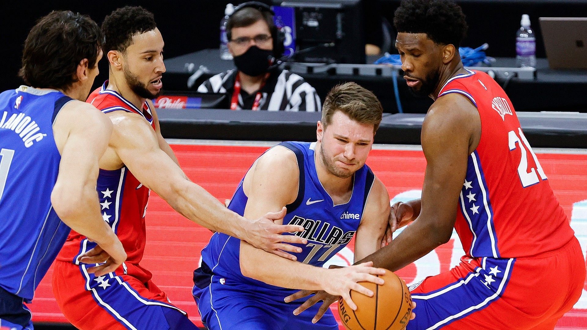 Luka Doncic of the Dallas Mavericks against Joel Embiid and Ben Simmons of the Philadelphia 76ers