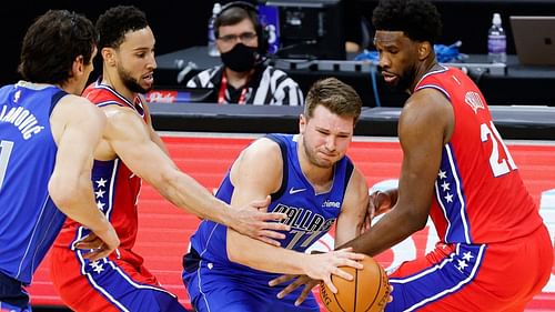 Luka Doncic of the Dallas Mavericks against Joel Embiid and Ben Simmons of the Philadelphia 76ers