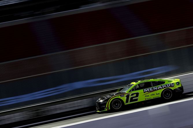 Watch: Ryan Blaney attempts to throw HANS device at Erik Jones