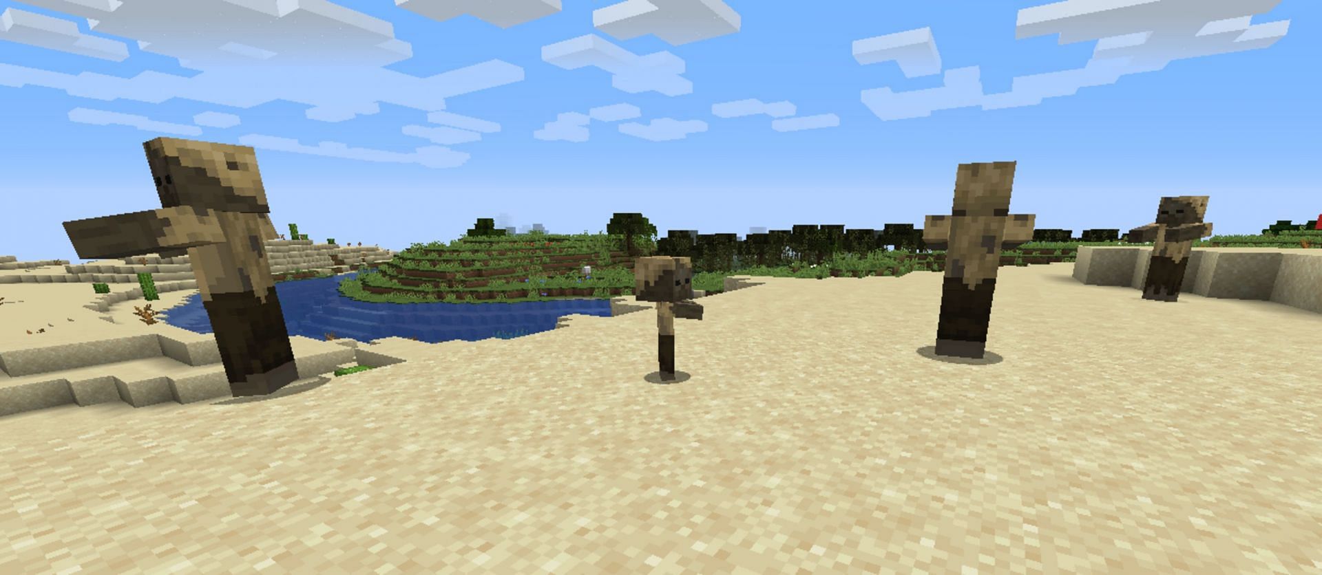 Baby and adult husks roam a desert biome (Image via Minecraft.net)
