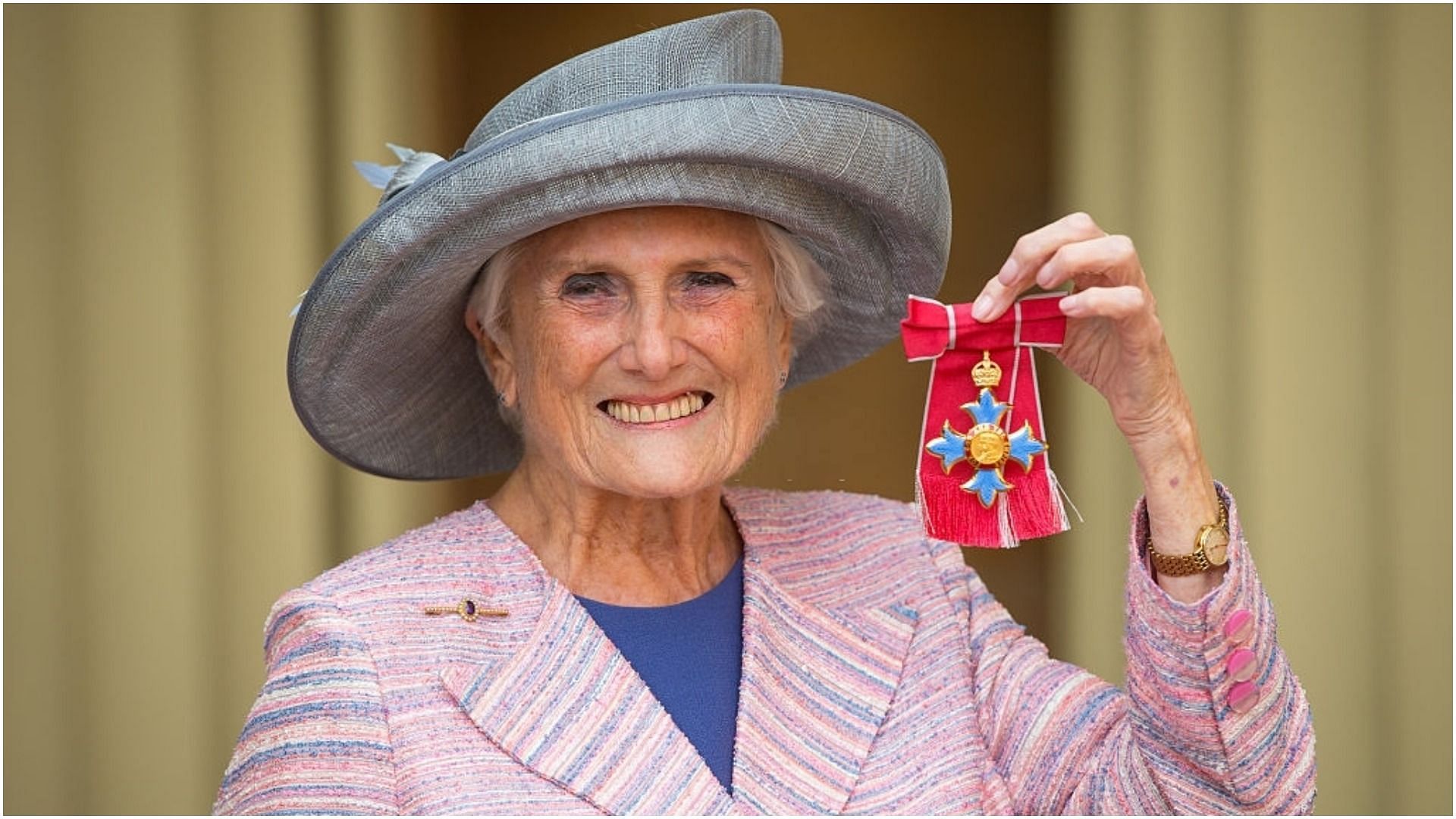 Beryl Vertue with her Commander of the Order of the British Empire (CBE) medal (Image via Dominic Lipinski/Getty Images)