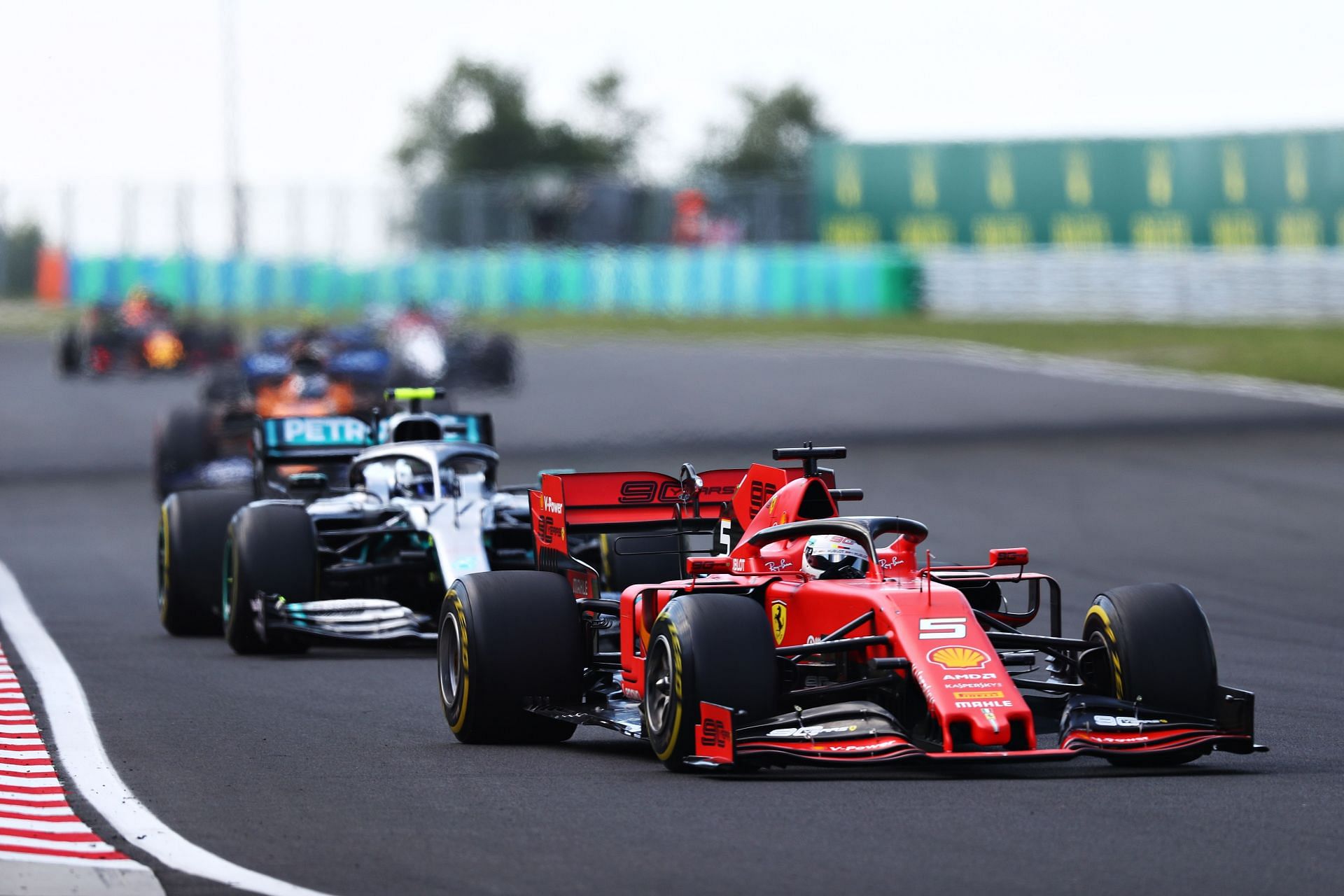 Sebastian Vettel (front) and Valtteri Bottas (back) in action during the 2019 Hungarian Grand Prix (Photo by Lars Baron/Getty Images)