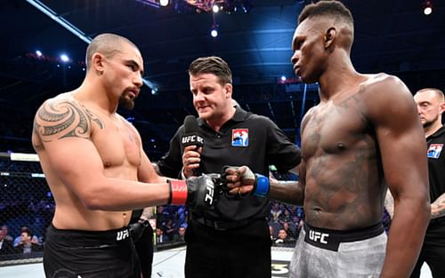 Robert Whittaker (left); Israel Adesanya (right)