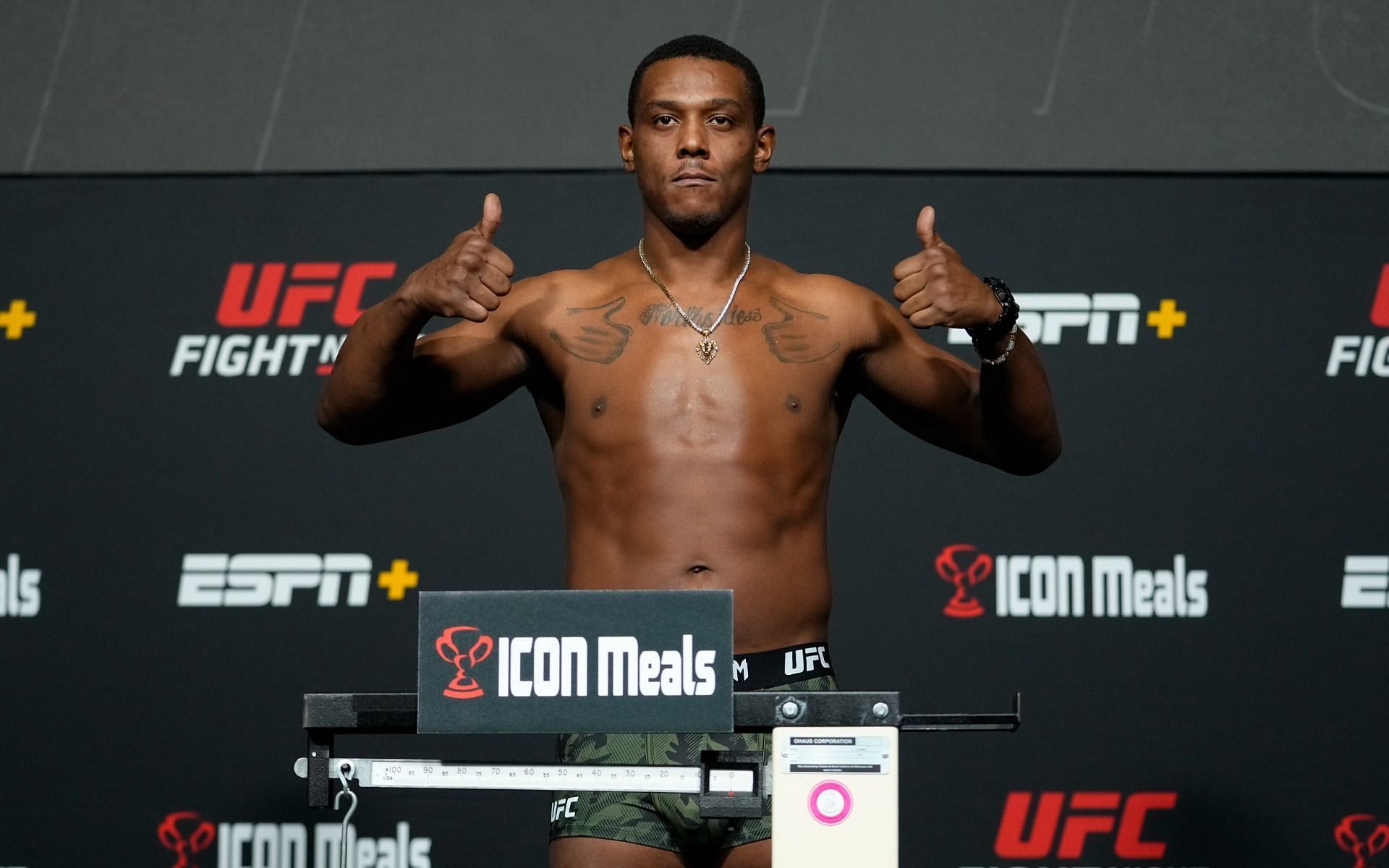Hill poses on the scale during the UFC Fight Night 201 aka UFC Vegas 48 weigh-ins in Las Vegas, Nevada on Friday