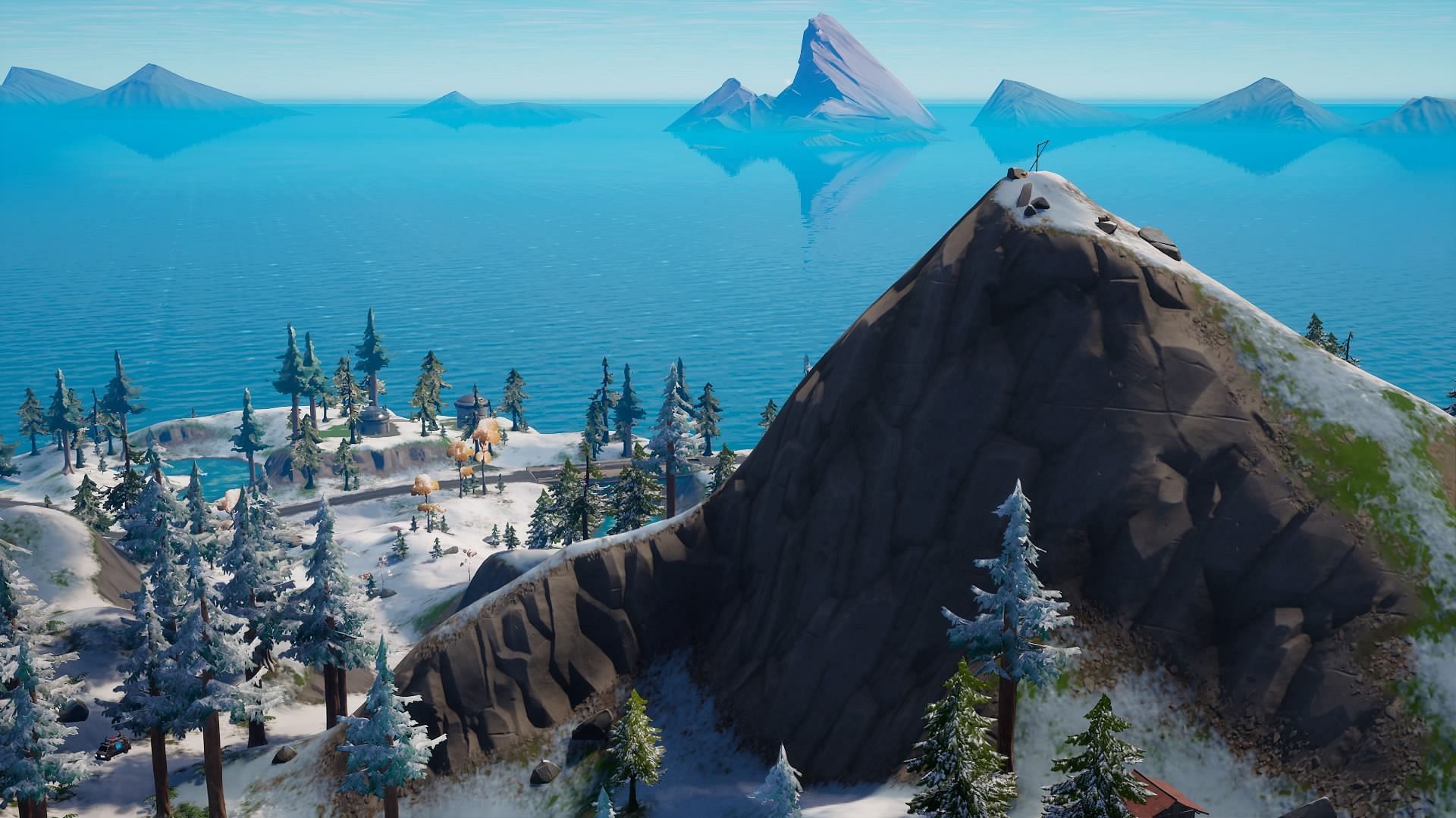 Fortnite&#039;s Pinnacle Peak climbs over Covert Cavern on the west side of the map (Image via Epic Games)