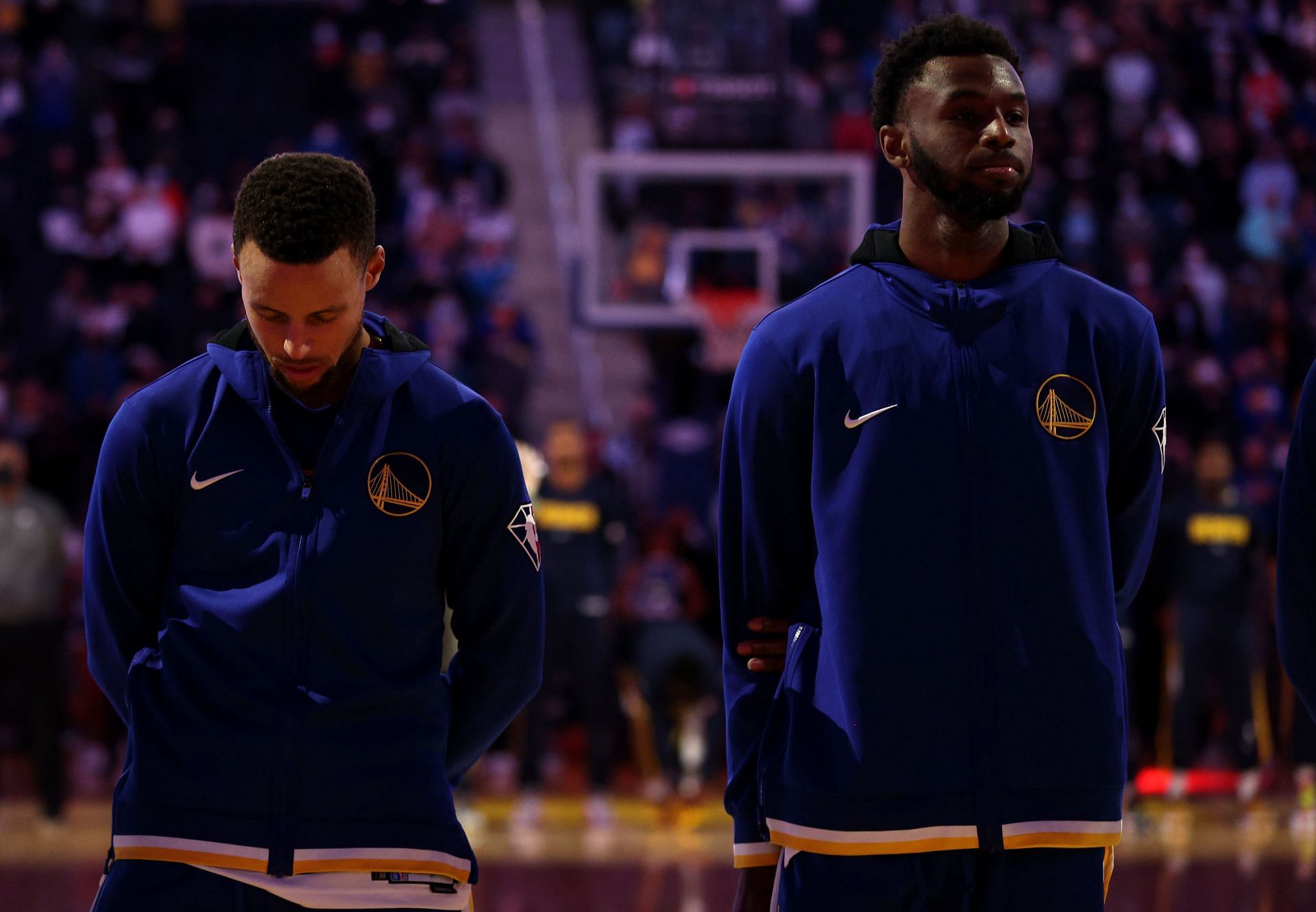Steph Curry and Andrew Wiggins lining up in a game for the Golden State Warriors