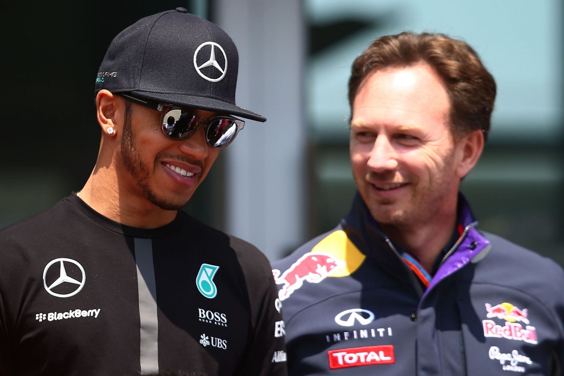 Lewis Hamilton chats with Christian Horner during final practice for the 2015 Chinese Grand Prix (Photo by Mark Thompson/Getty Images)