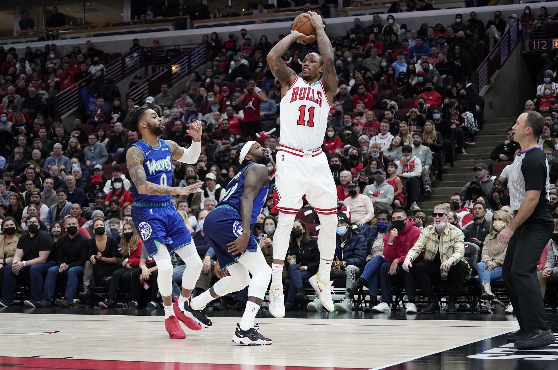 DeMar DeRozan of the Chicago Bulls shoots over Patrick Beverley of the Minnesota Timberwolves