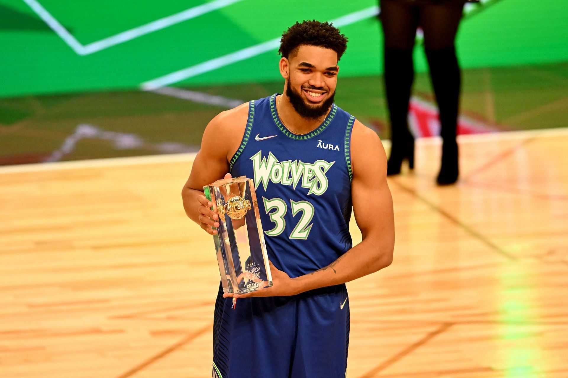 Karl-Anthony Towns of the Minnesota Timberwolves holds the trophy after winning the 3-Point Contest