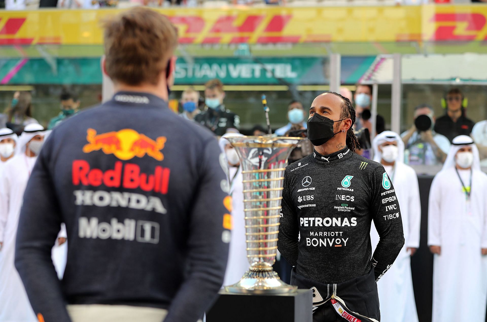 F1 Grand Prix of Abu Dhabi - Lewis Hamilton (aft) and Max Verstappen (fore) eye the trophy
