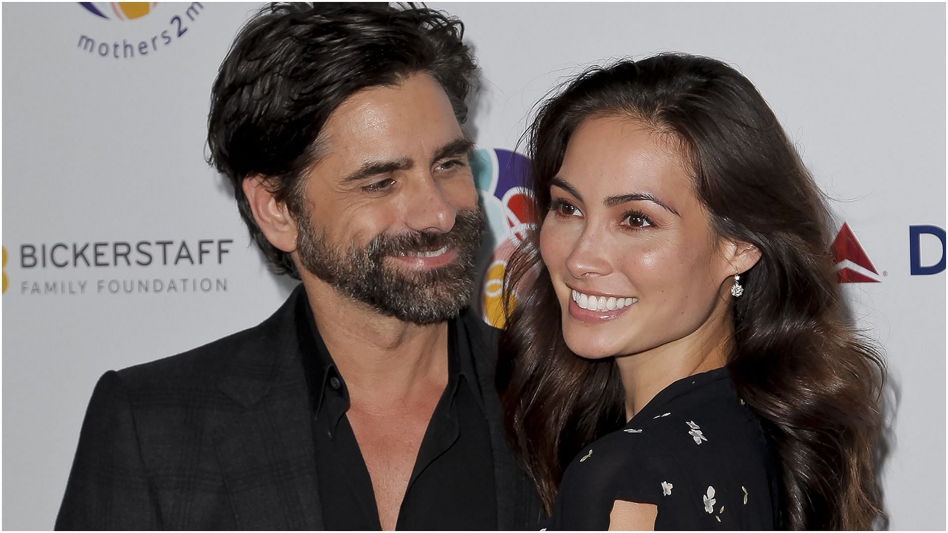 John Stamos and Caitlin McHugh got engaged in 2017 and welcomed their first child a year later (Image via Tibrina Hobson/Getty Images)