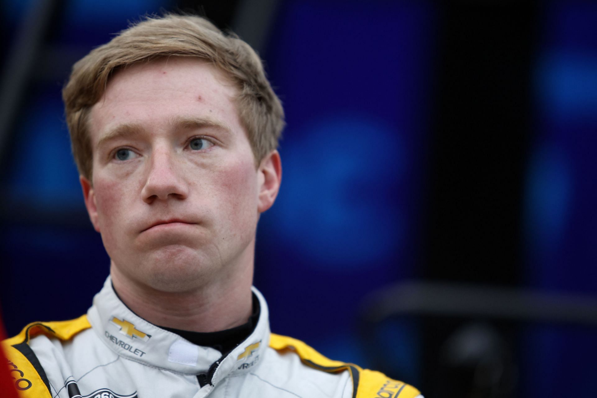 Tyler Reddick looking on in the garage area during practice at Daytona International Speedway