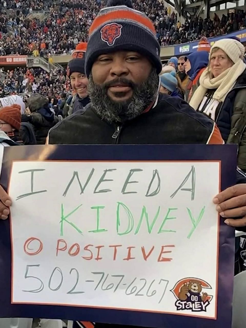 Edwards holding his sign seeking a kidney donor