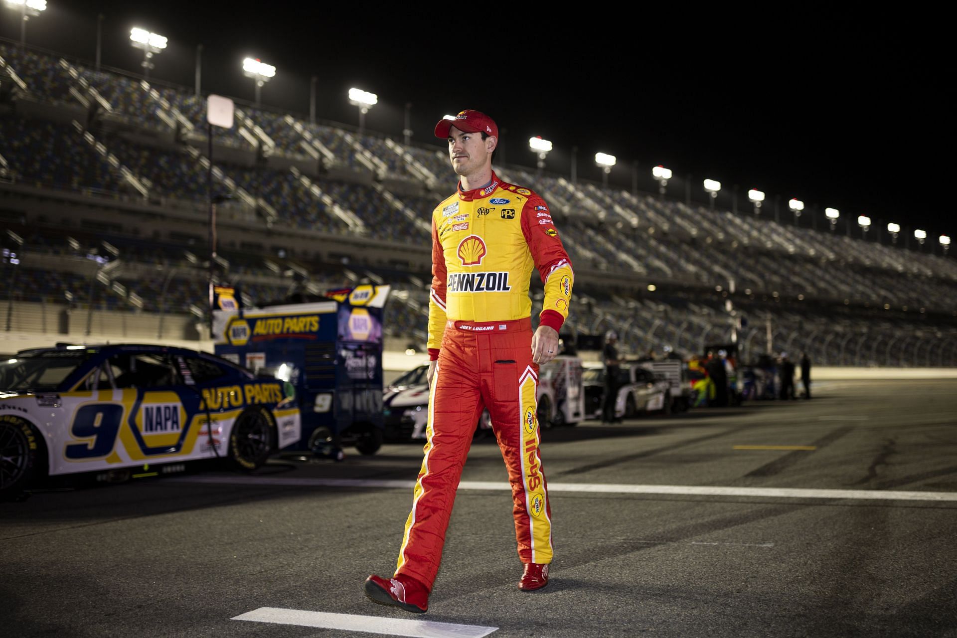 Joey Logano walks the pit lane during NASCAR Cup Series 64th Annual Daytona 500 qualifying (Photo by James Gilbert/Getty Images)