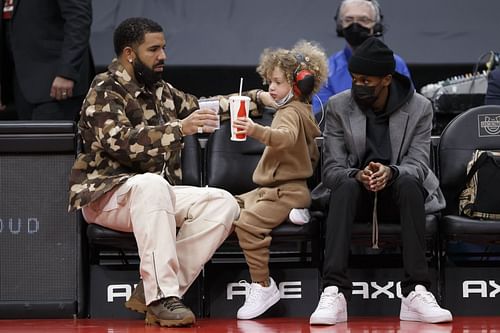 Drake and his son Adonis at a Toronto Raptors game