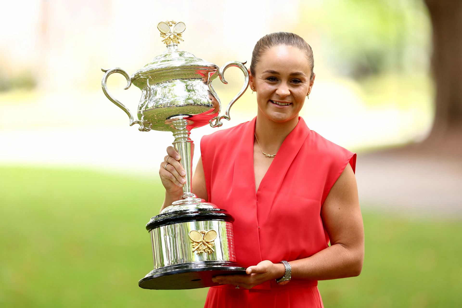 Ashleigh Barty poses with the Daphne Akhurst Memorial Cup after winning the 2022 Australian Open