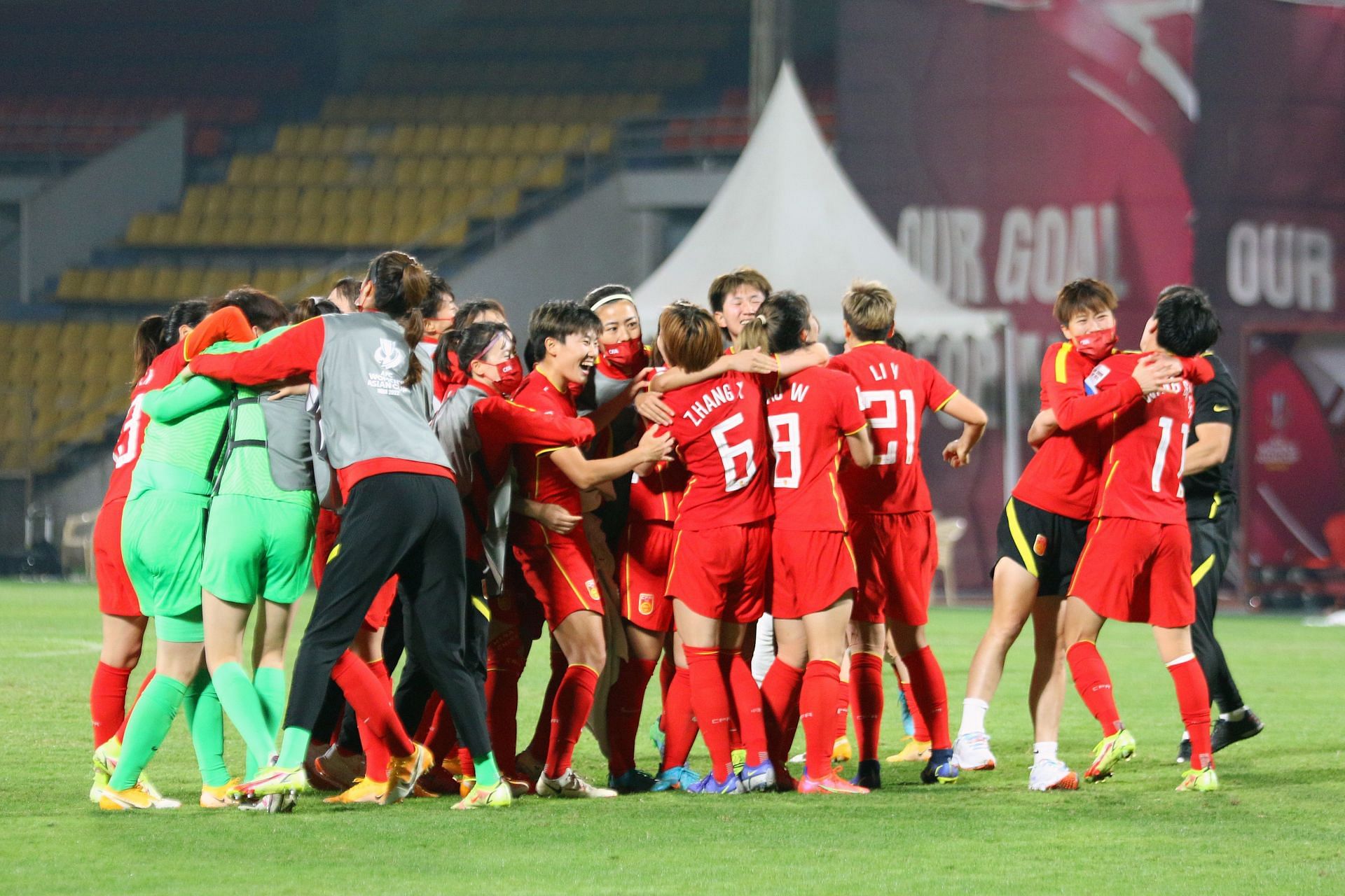 China celebrate their penalty shoout-out win.