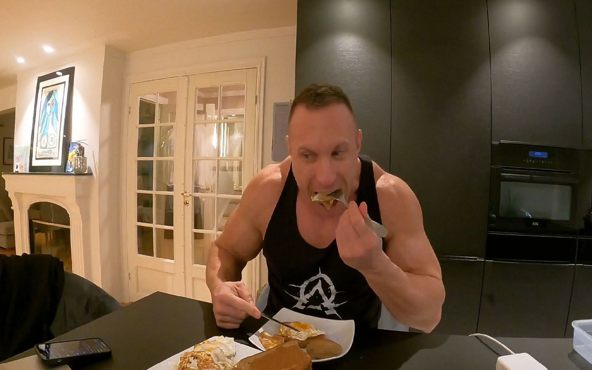 Knut prepares and consumes a 5000 calorie meal as he livestreams (Images via Twitch/Knut)