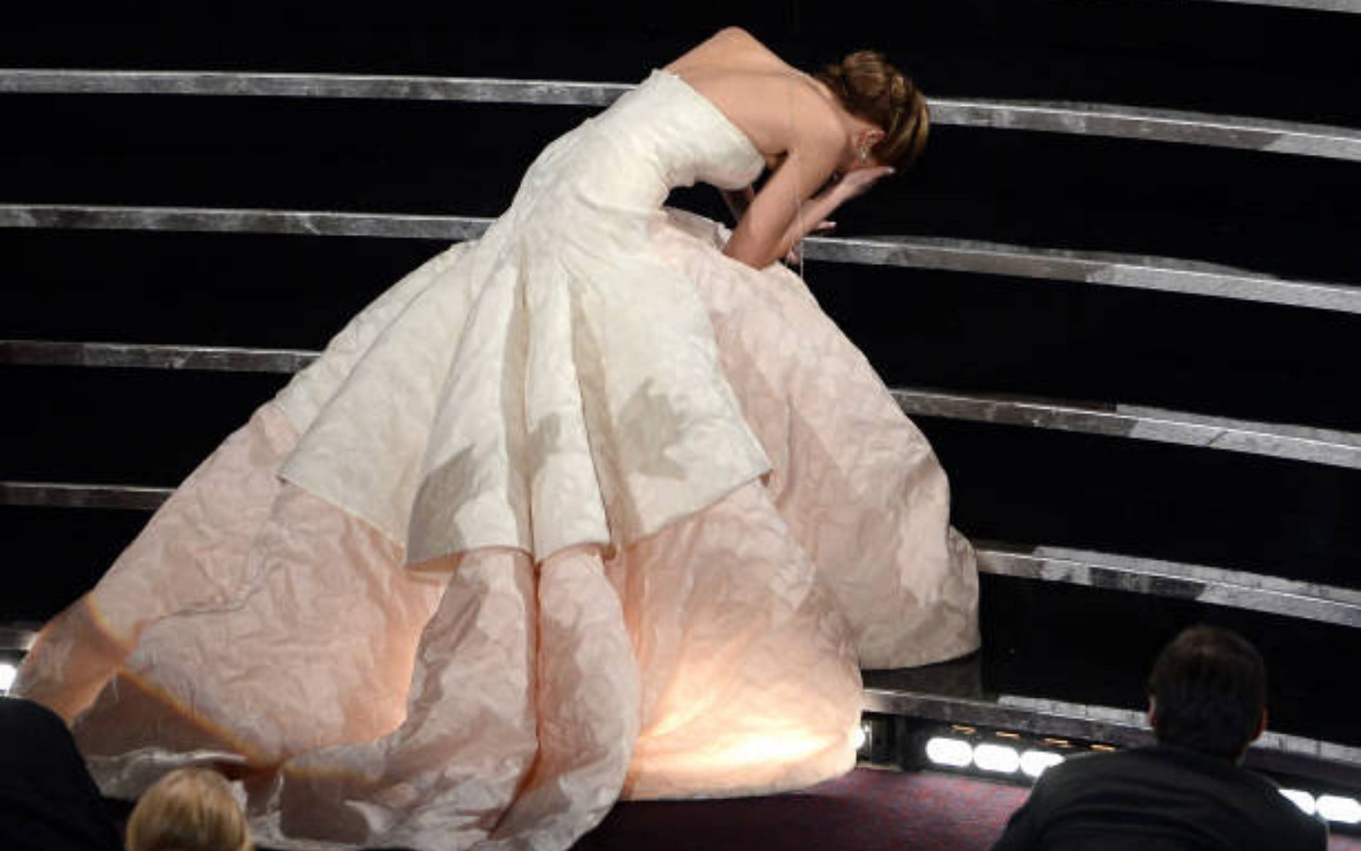 Jennifer Lawrence tripped while climbing the stairs to collect her first Oscar at the 85th Academy Awards (Image via Getty Images)
