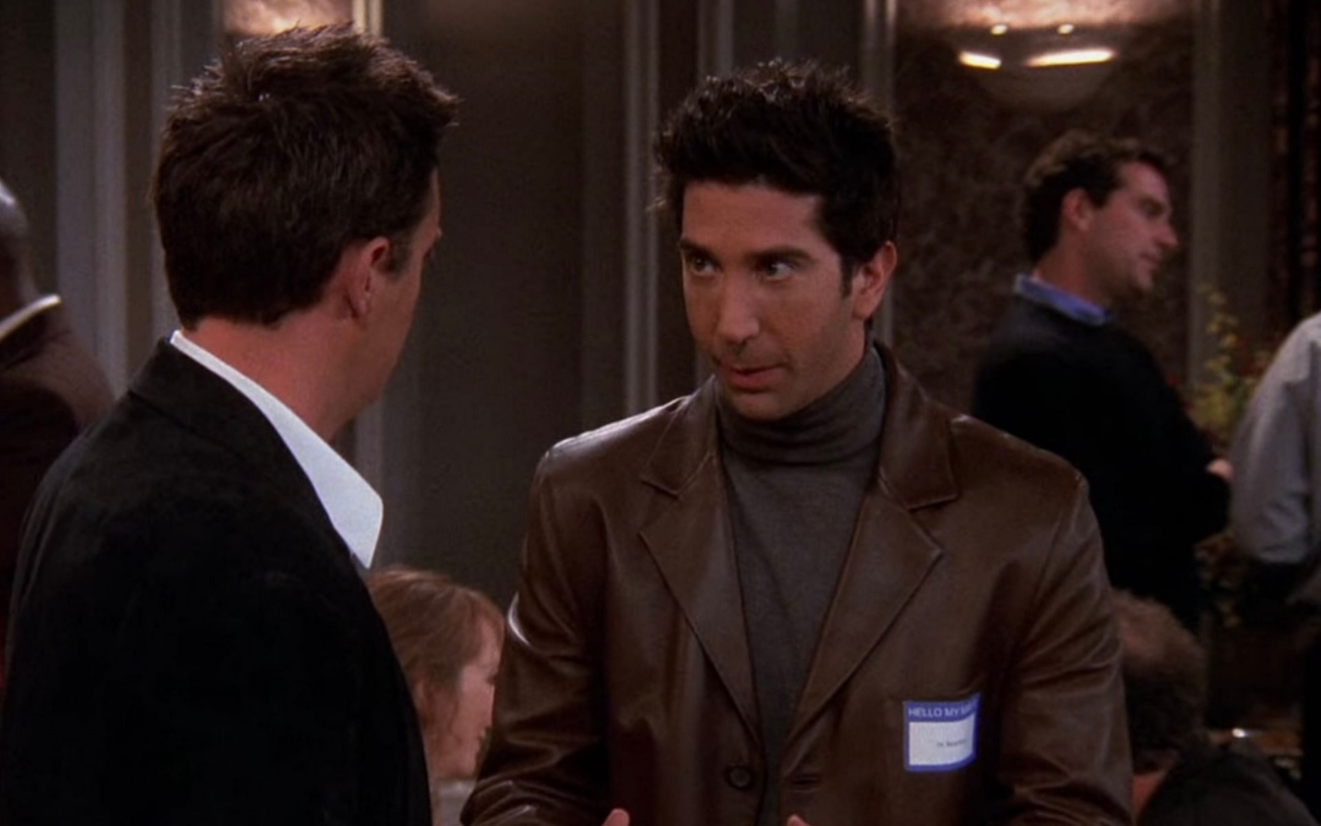 Ross Geller in a turtleneck and leather jacket (Image via Netflix)