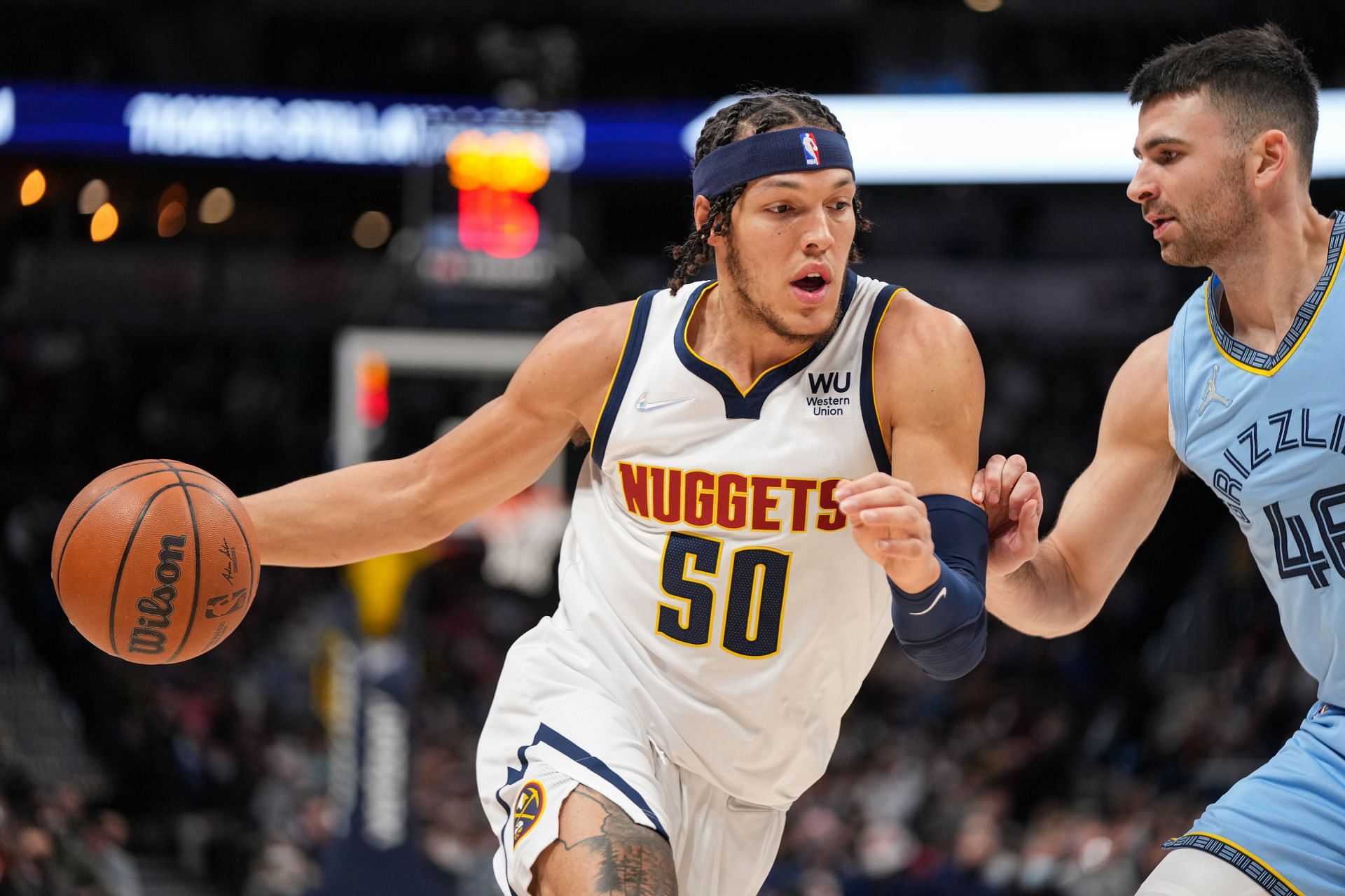 Aaron Gordon attempts to dribble past a defender.