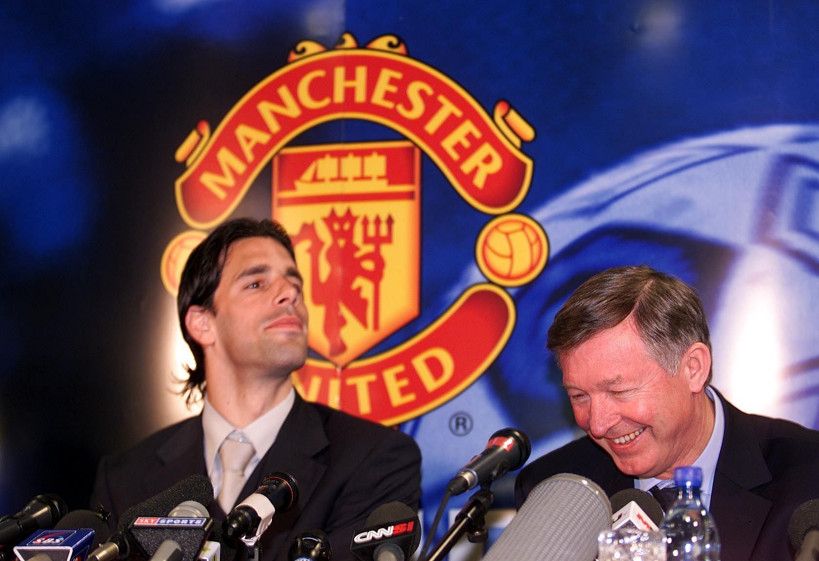 Ruud van Nistelrooy (left) looks on at his Manchester United unveiling.