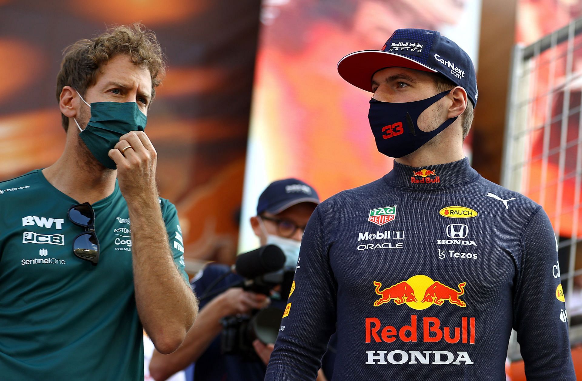 Max Verstappen (right) and Sebastian Vettel (left) in the F1 paddock in Abu Dhabi (Photo by Bryn Lennon/Getty Images)