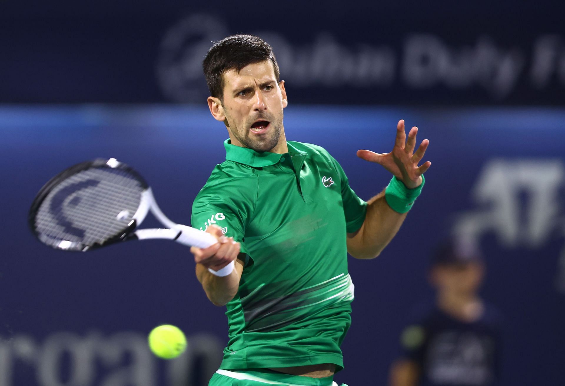 Novak Djokovic hits a forehand at the 2022 Dubai Open