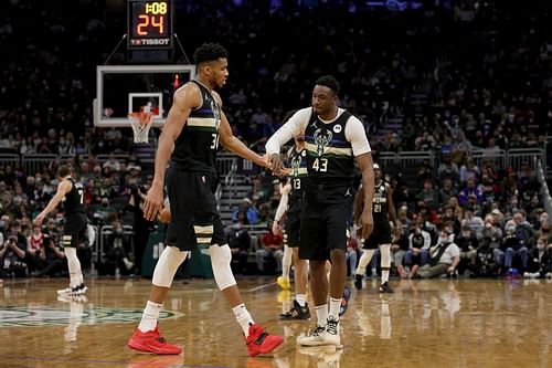 Giannis Antetkounmpo celebrates a play with his older brother, Thanasis