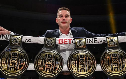 BKFC President David Feldman poses with the promotion's belts. Image via. Instagram/davidfeldmanbkfc