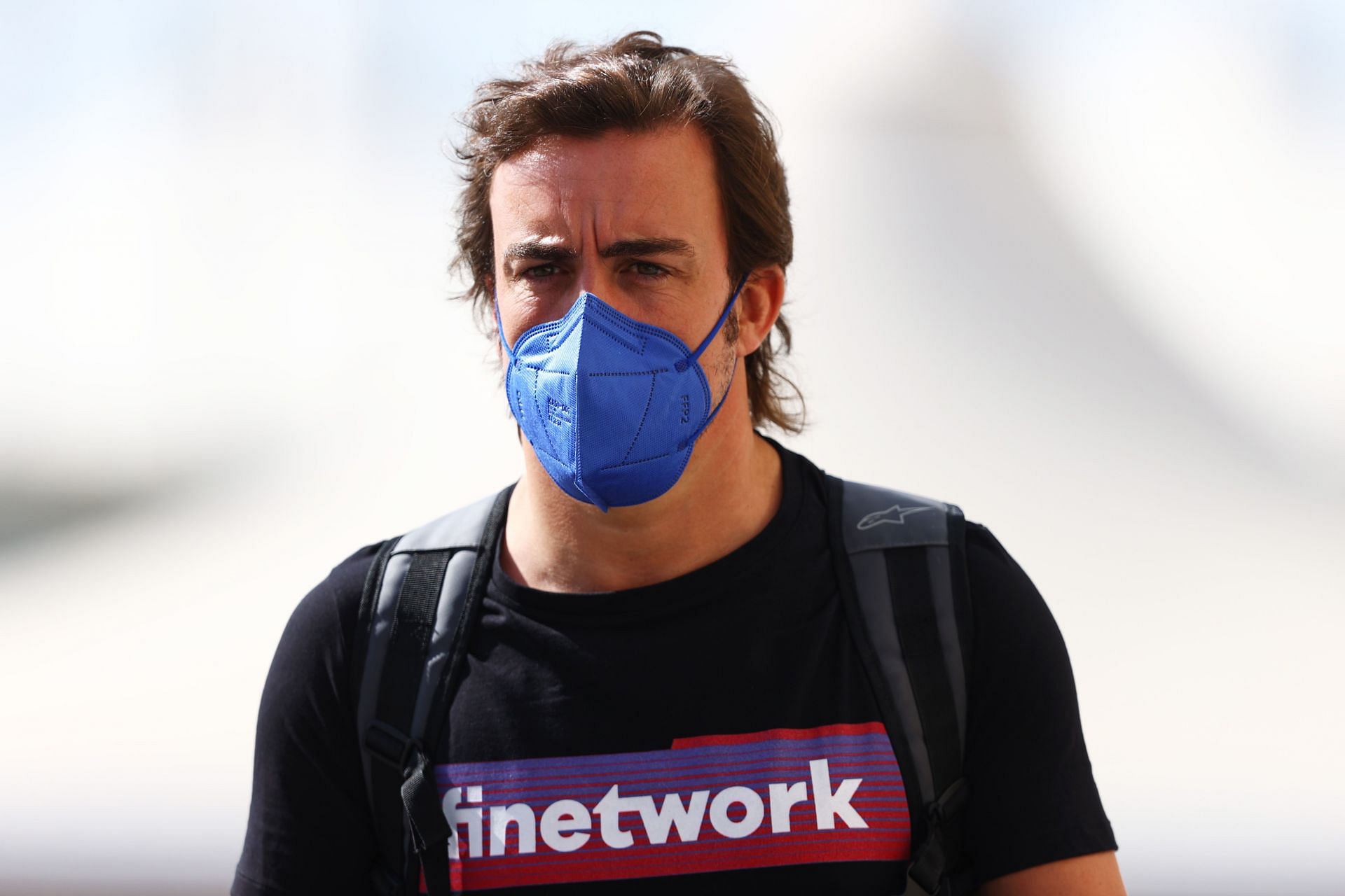 Fernando Alonso walks in the Paddock during previews in Abu Dhabi, United Arab Emirates (Photo by Bryn Lennon/Getty Images)
