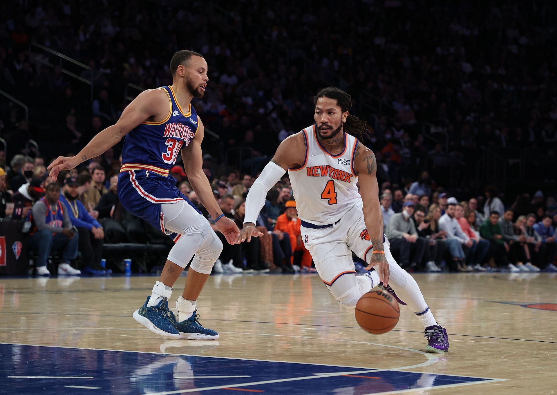 Derrick Rose of the New York Knicks drives against Stephen Curry of the Golden State Warriors