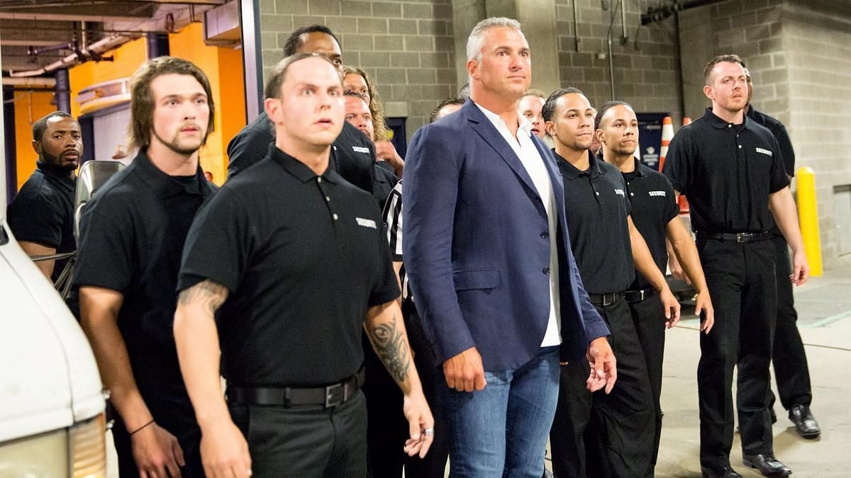 Shane McMahon with WWE&#039;s security personnel backstage