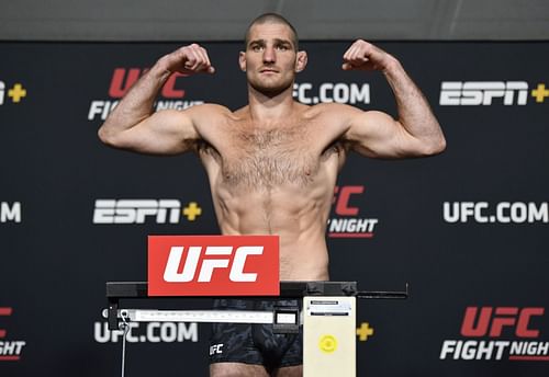 Sean Strickland poses at a weigh-in