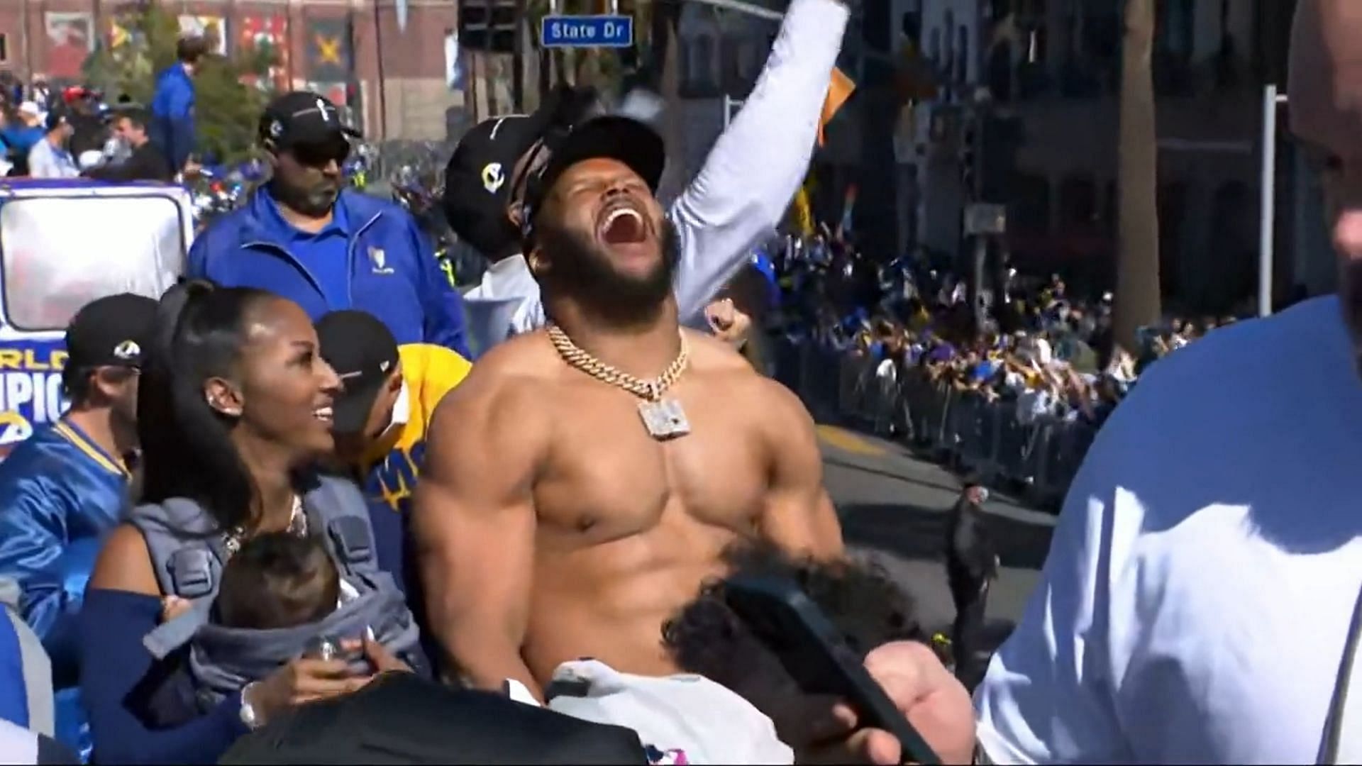 Aaron Donald celebrates shirtless with his family during Super Bowl parade