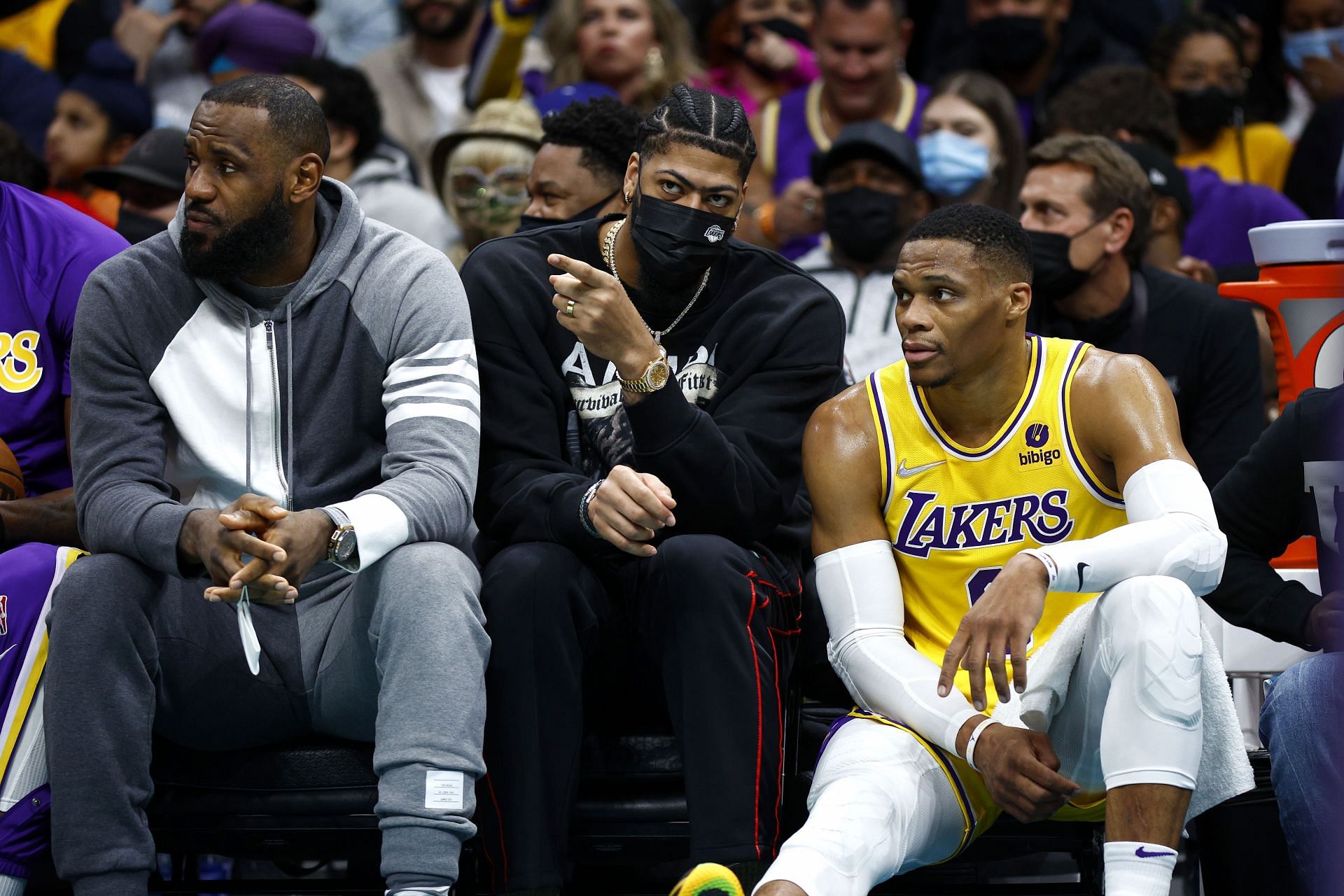 LeBron James, Anthony Davis, and Russell Westbrook of the LA Lakers watch from the bench