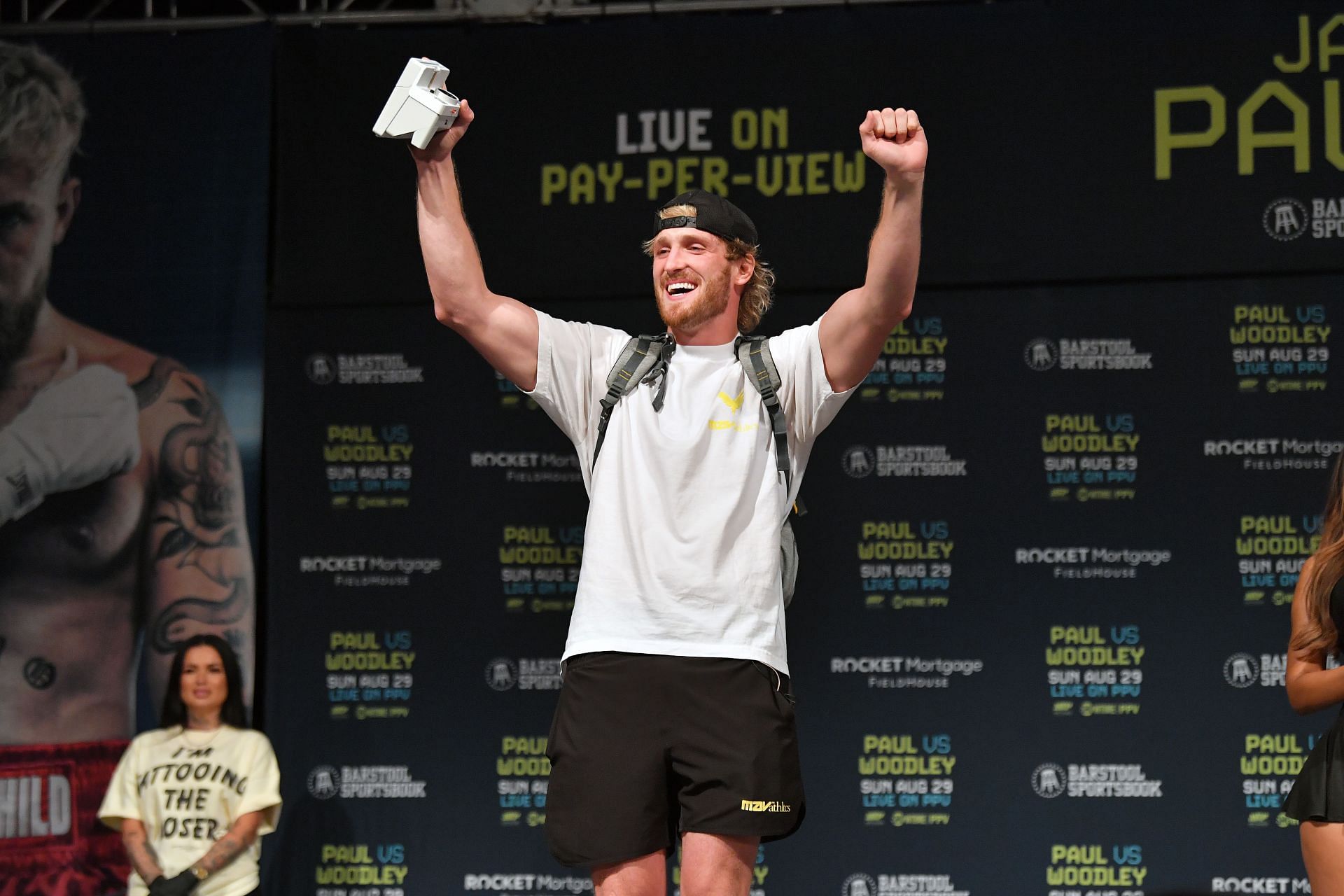 Logan Paul onstage during the Paul vs. Woodley weigh-ins