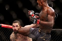 Watch: Israel Adesanya hilariously pulls off 'paper beats rock' while touching gloves with Robert Whittaker at UFC 271