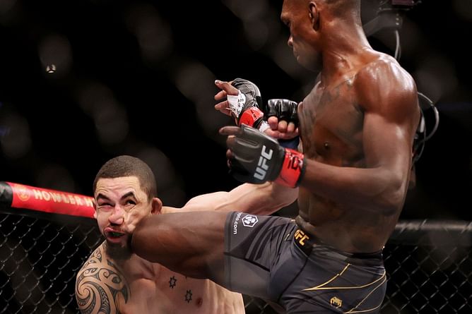 Watch: Israel Adesanya hilariously pulls off 'paper beats rock' while touching gloves with Robert Whittaker at UFC 271
