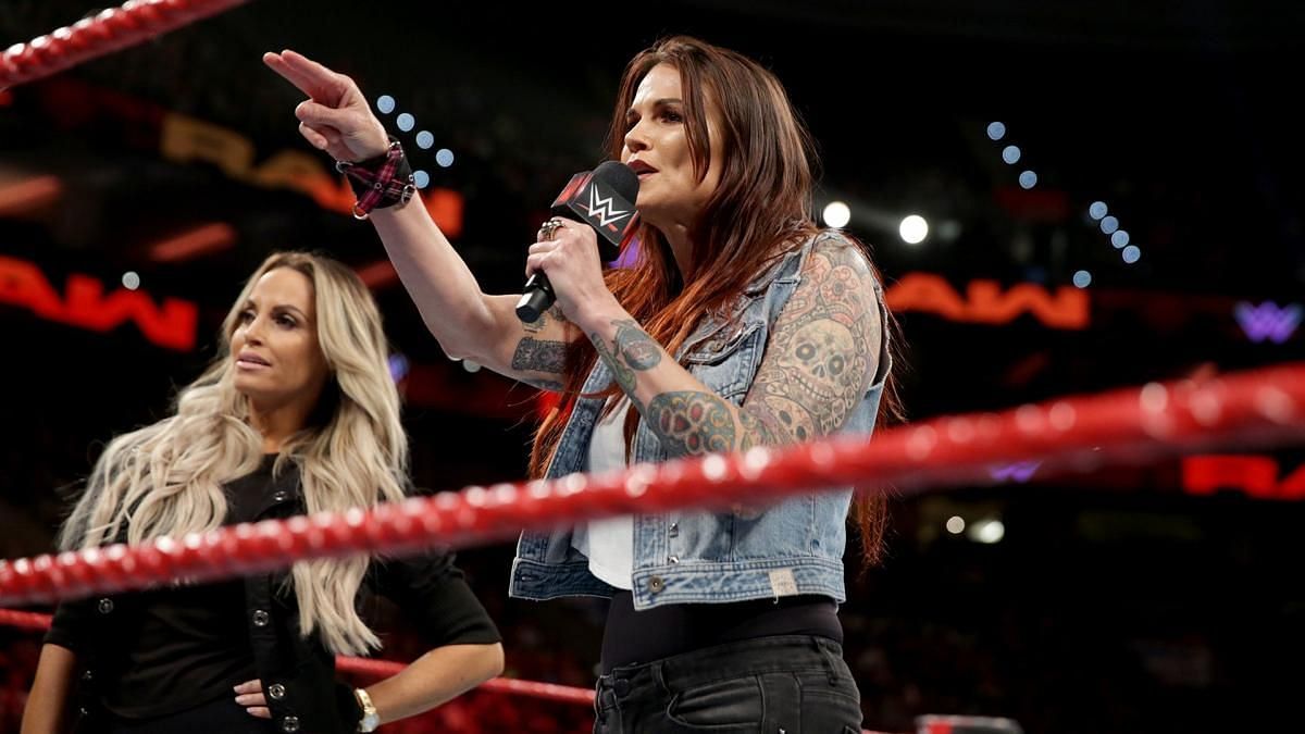 WWE Hall of Famer Lita on the microphone in the ring with Trish Stratus live on RAW