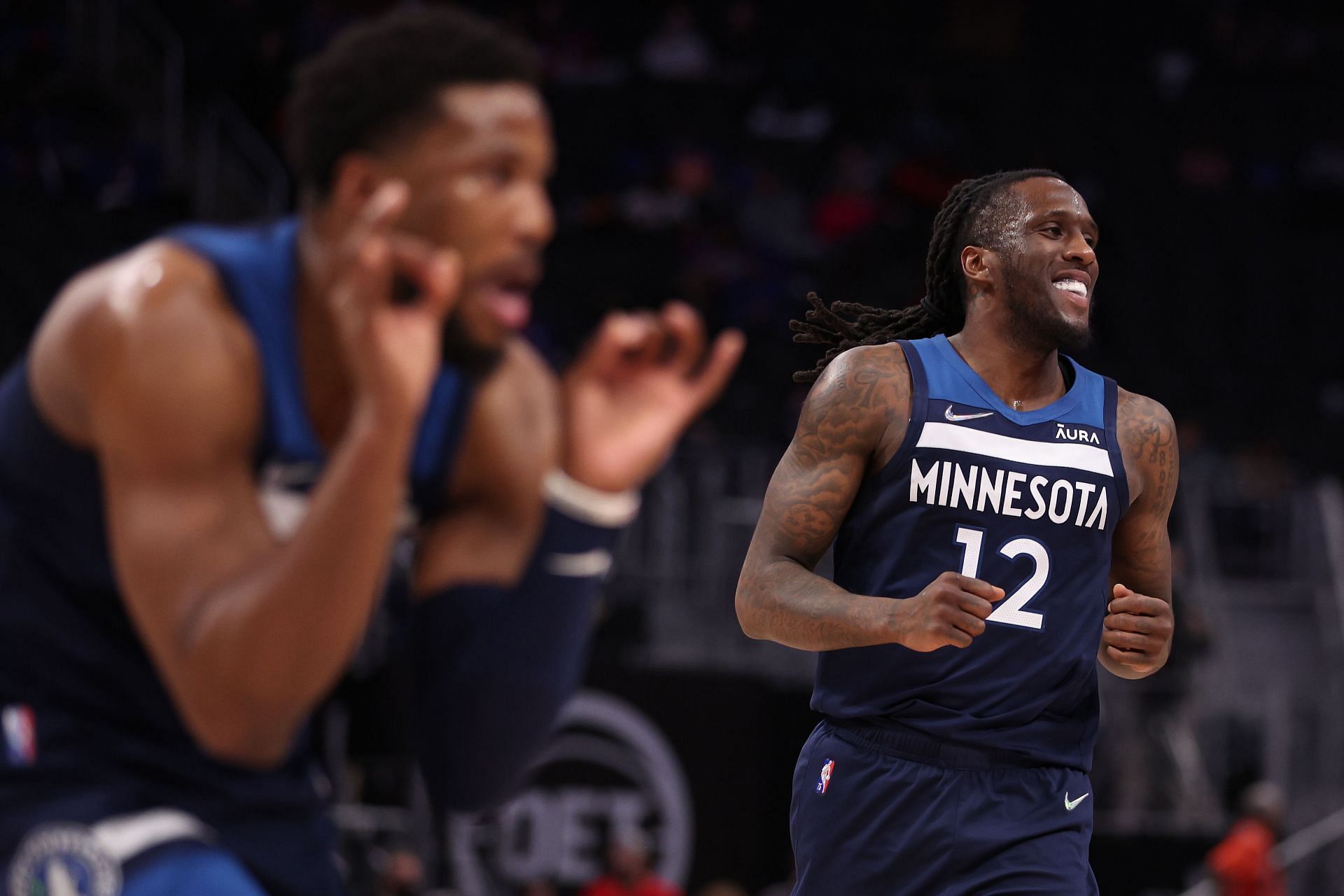 Taurean Prince of the Minnesota Timberwolves celebrates with Malik Beasley