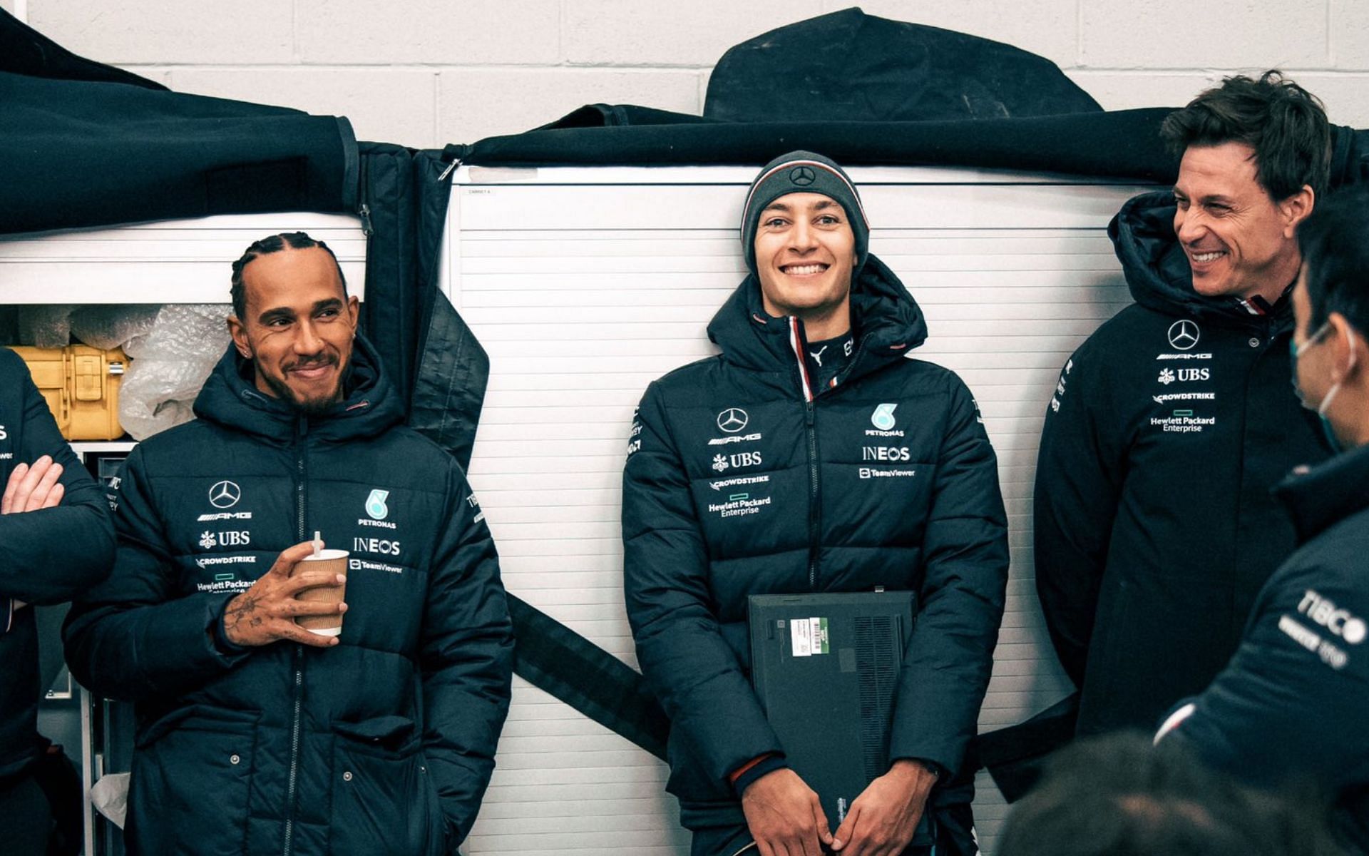 Toto Wolff (right) with Lewis Hamilton (left) and George Russell (centre) at Mercedes factory in Brackley