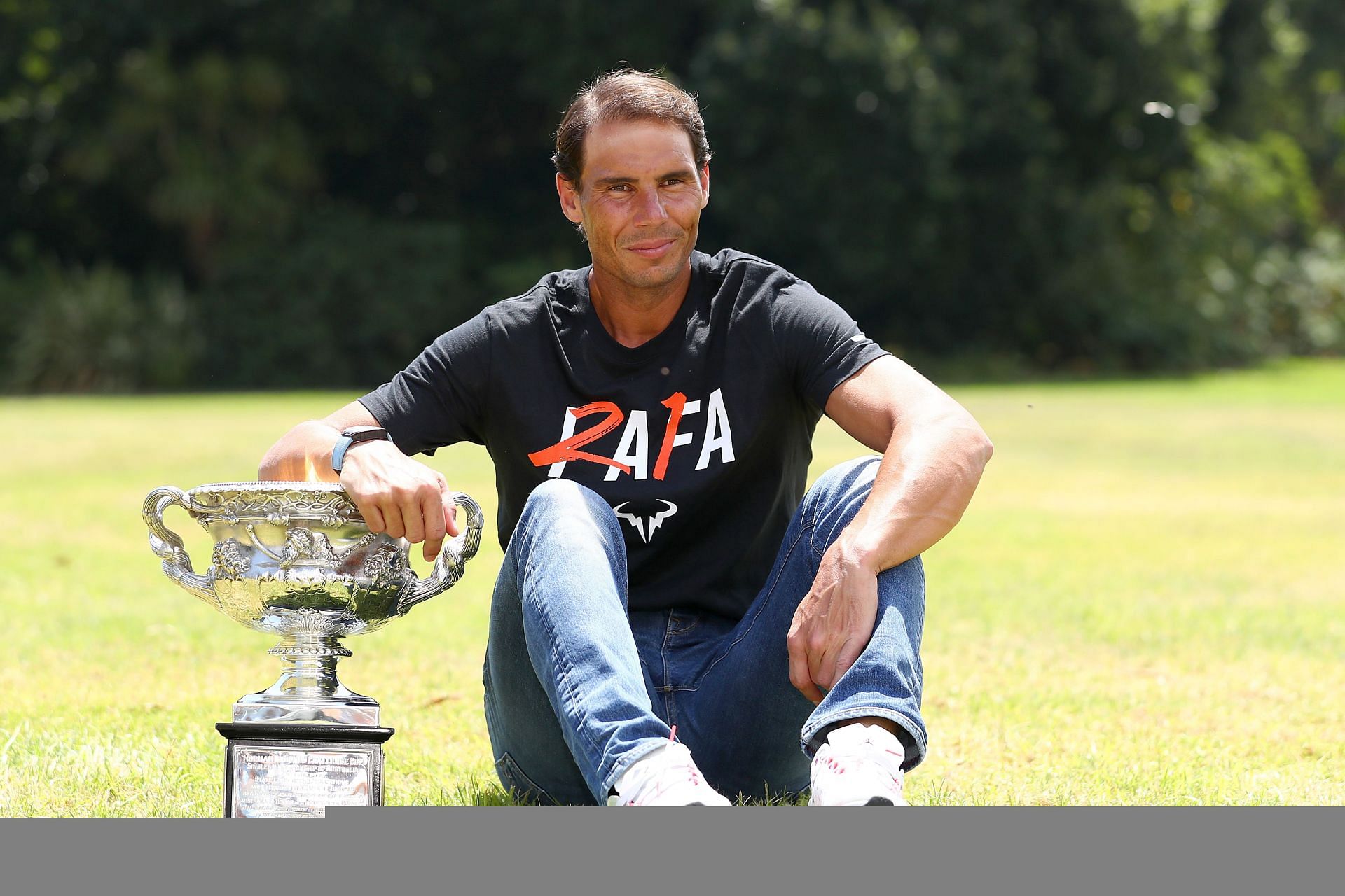 Rafael Nadal posing with his Australian Open 2022 trophy