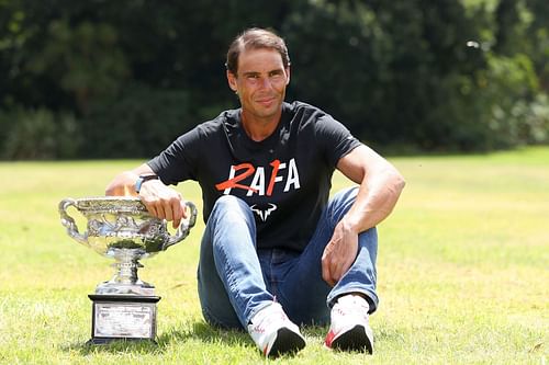 Rafael Nadal posing with his Australian Open 2022 trophy