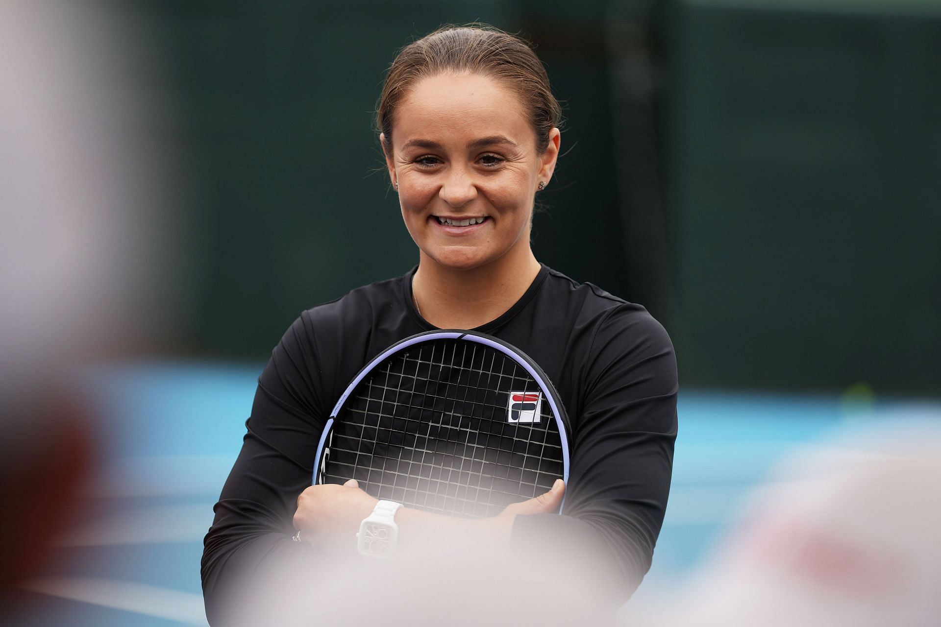 Ashleigh Barty smiles as she attends a media opportunity at Kooyong in Melbourne