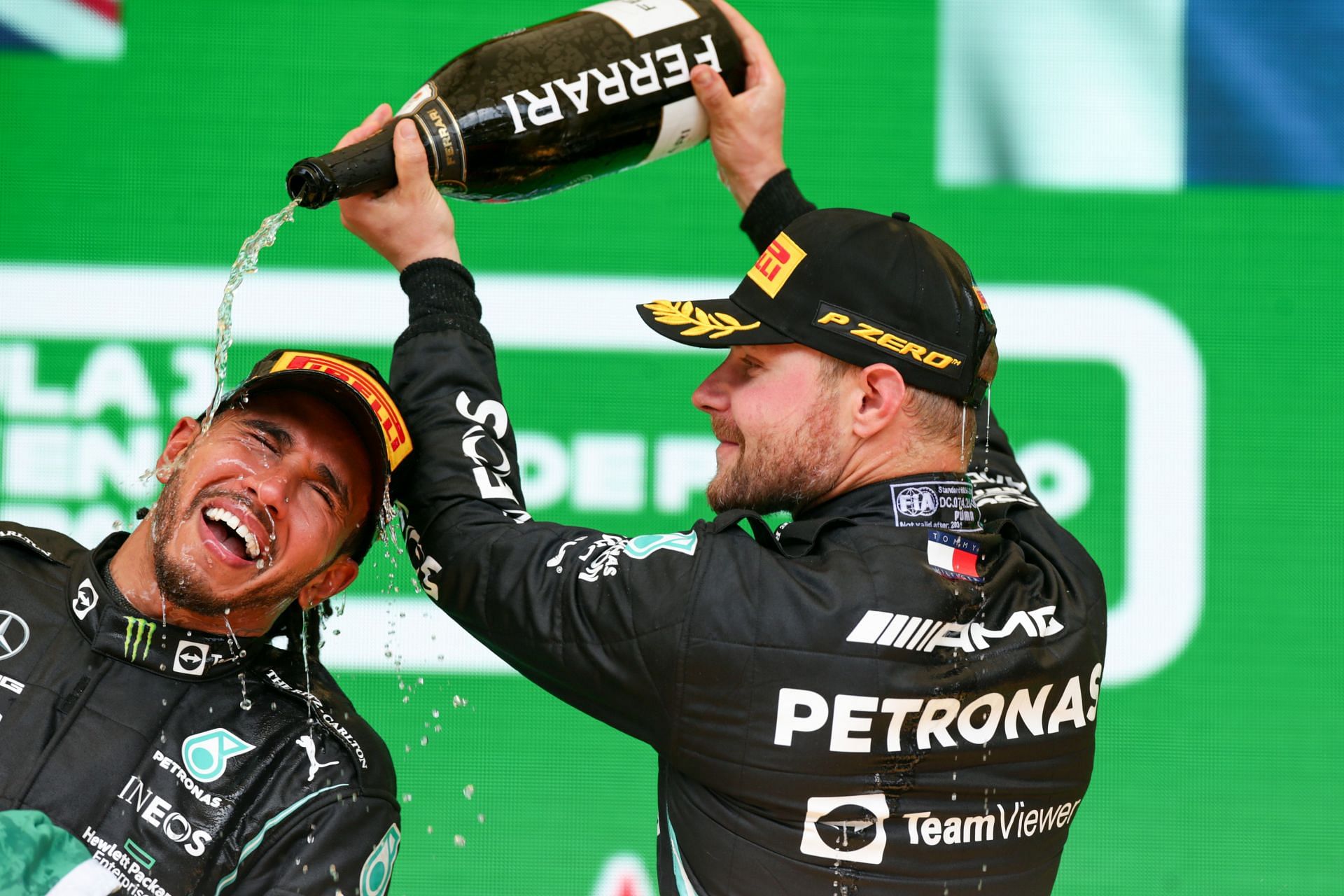 Lewis Hamilton (left) and Valterri Bottas (right) celebrate finishing in first and third positions at the Brazil Grand Prix (Photo by Peter Fox/Getty Images)