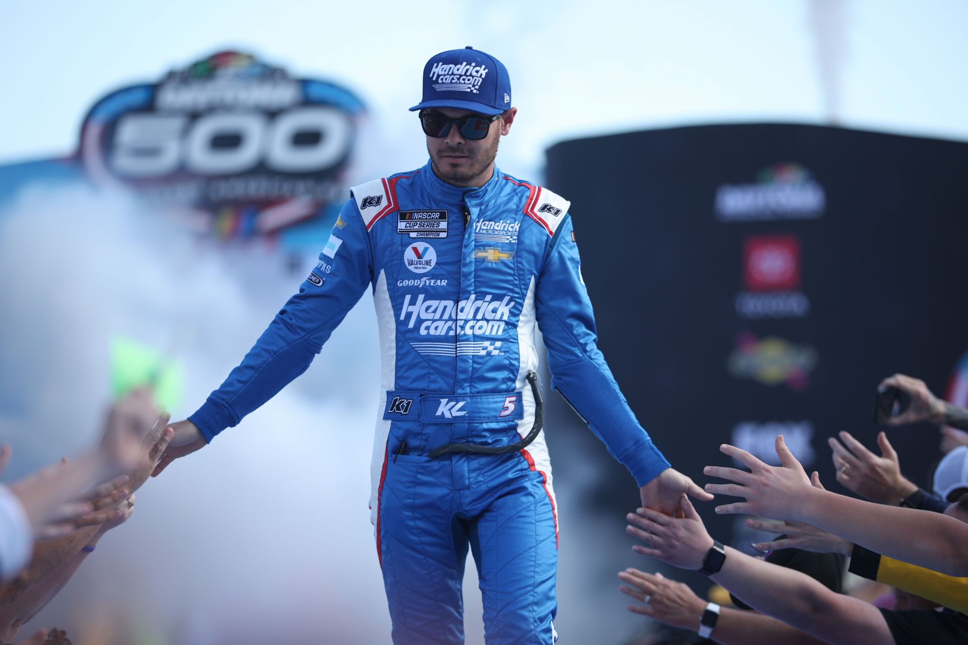 Kyle Larson greets fans before the NASCAR Cup Series 64th Annual Daytona 500 (Photo by James Gilbert/Getty Images)