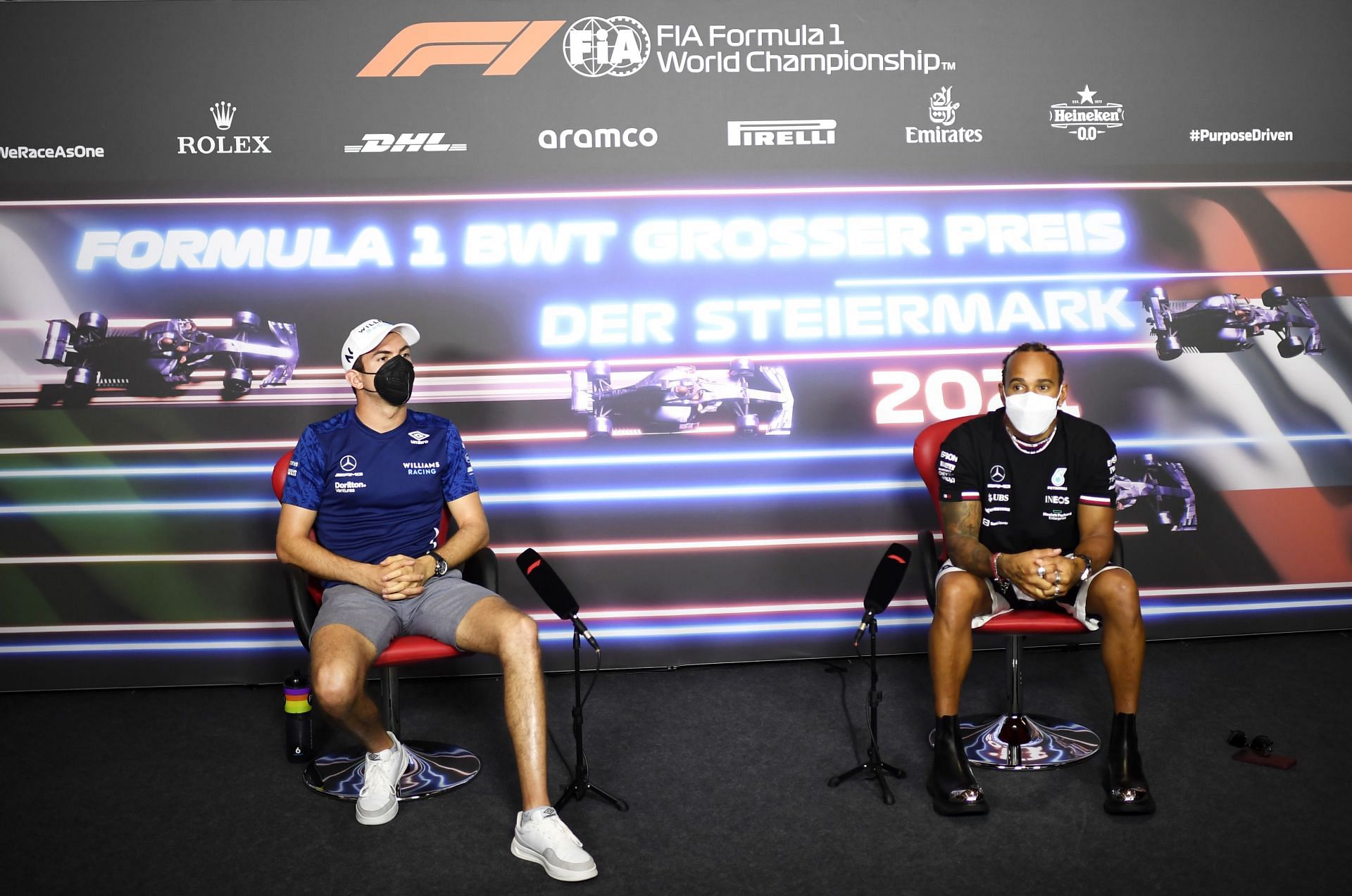 Nicholas Latifi (left) and Lewis Hamilton (right) talk at the drivers&#039; press conference ahead of the Styrian Grand Prix in Austria (Photo by Christian Bruna - Pool/Getty Images)