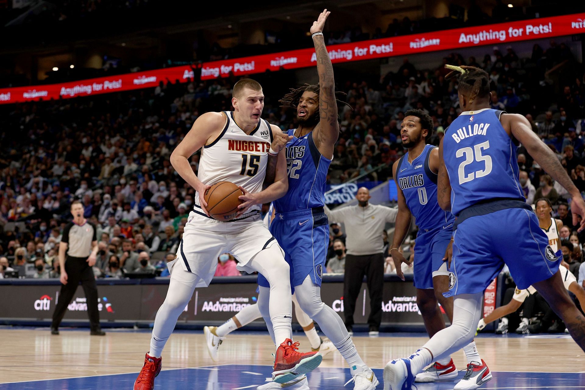 Nikola Jokic attempts to finish through contact.