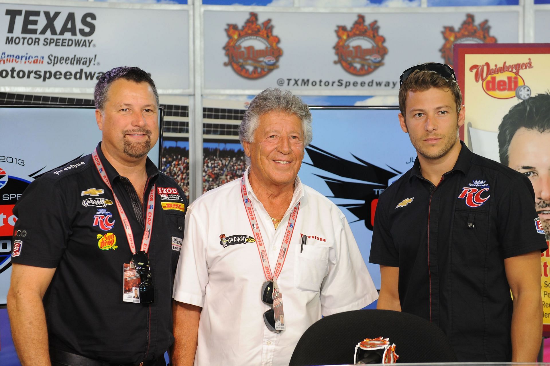 Former F1 world champion Mario Andretti (C) with his son and team owner Michael Andretti (L) and grandson Marco Andretti (R), driver of the #25 RC Cola Andretti Autosport Chevrolet, before the IZOD IndyCar Series Firestone 550 (Photo by Will Schneekloth/Getty Images for Texas Motor Speedway)